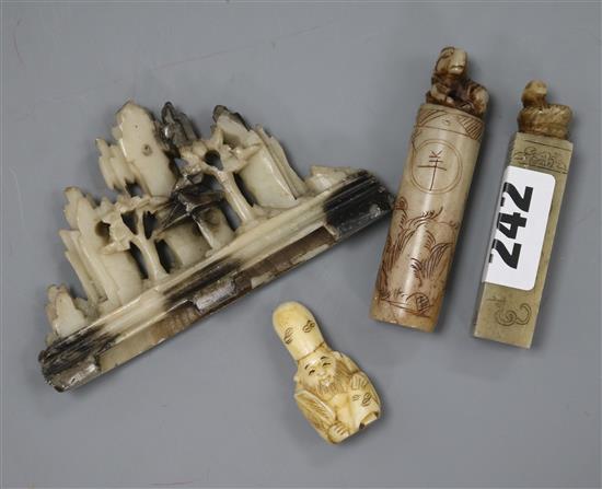 Two Chinese soapstone seals, a similar brush rest and an ivory netsuke